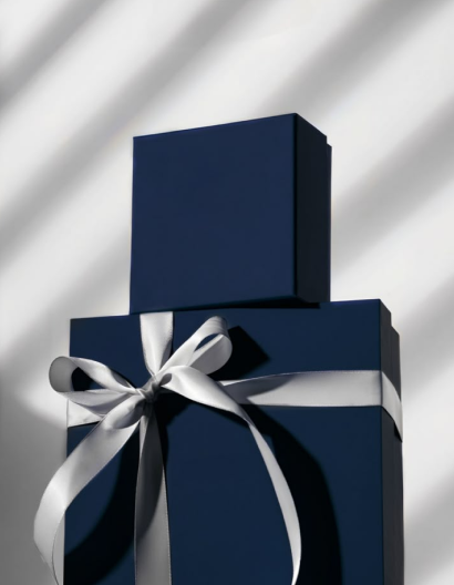 Navy gift boxes wrapped with a silver satin bow